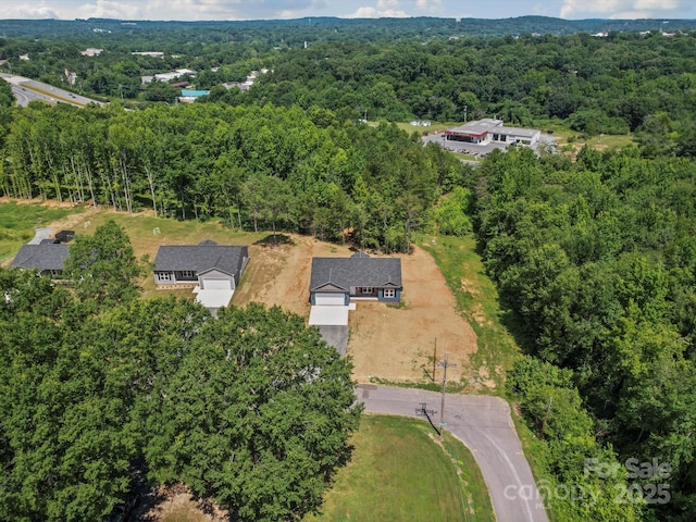 205 S Hill Ave, Albemarle, NC 28001 - aerial view of property and surrounding area featuring a heavily wooded area