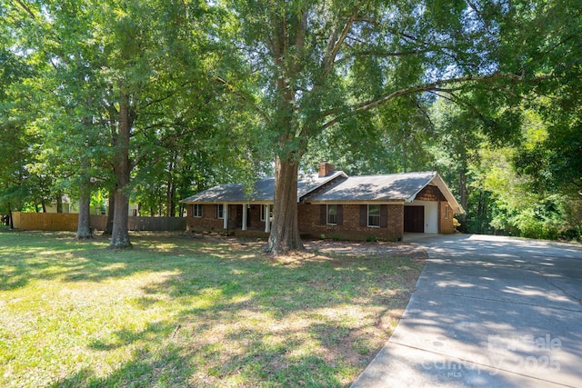 10120 Withers Rd, Charlotte, NC 28278 - single story home with a chimney, concrete driveway, and brick siding