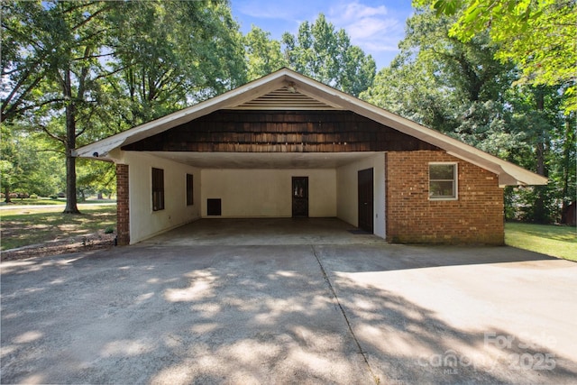 10120 Withers Rd, Charlotte, NC 28278 - view of property exterior with concrete driveway, a carport, and brick siding