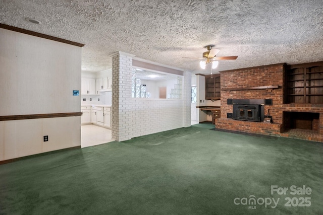 10120 Withers Rd, Charlotte, NC 28278 - unfurnished living room with a ceiling fan, carpet flooring, ornamental molding, and a textured ceiling