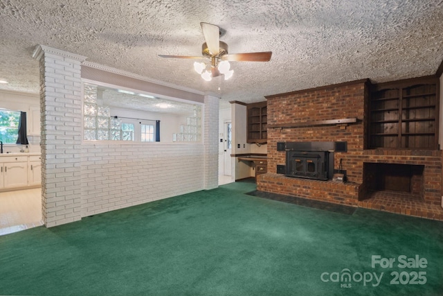 10120 Withers Rd, Charlotte, NC 28278 - unfurnished living room with healthy amount of natural light, carpet flooring, a brick fireplace, a ceiling fan, and brick wall