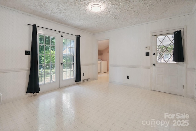 10120 Withers Rd, Charlotte, NC 28278 - entryway with washer and dryer, crown molding, french doors, a wainscoted wall, and a textured ceiling