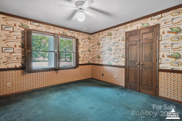 10120 Withers Rd, Charlotte, NC 28278 - empty room with wallpapered walls, crown molding, dark carpet, ceiling fan, and wainscoting