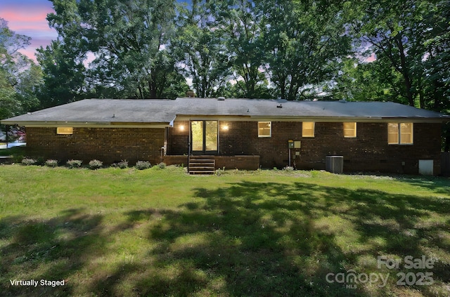 10120 Withers Rd, Charlotte, NC 28278 - back of house featuring brick siding and a lawn