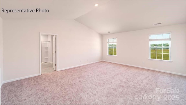 9223 Poquoson Dr, Gastonia, NC 28056 - carpeted empty room with vaulted ceiling and plenty of natural light