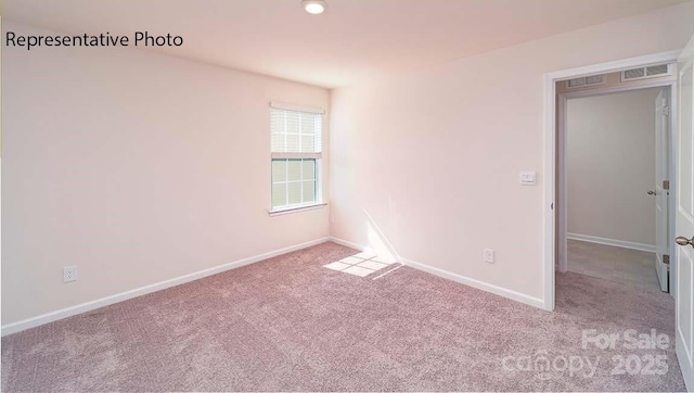 9223 Poquoson Dr, Gastonia, NC 28056 - carpeted spare room featuring baseboards