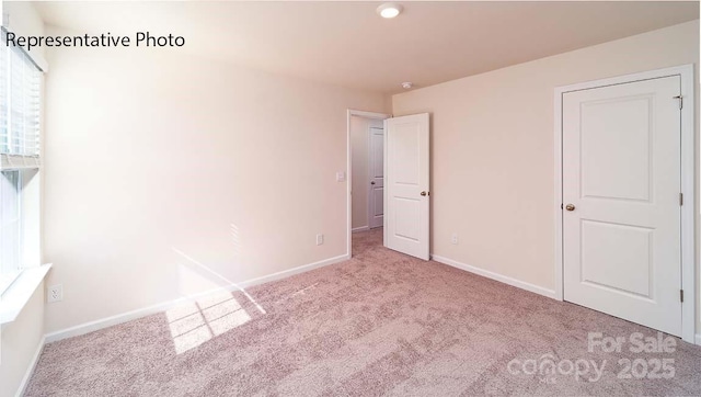 9223 Poquoson Dr, Gastonia, NC 28056 - unfurnished bedroom featuring carpet flooring and recessed lighting