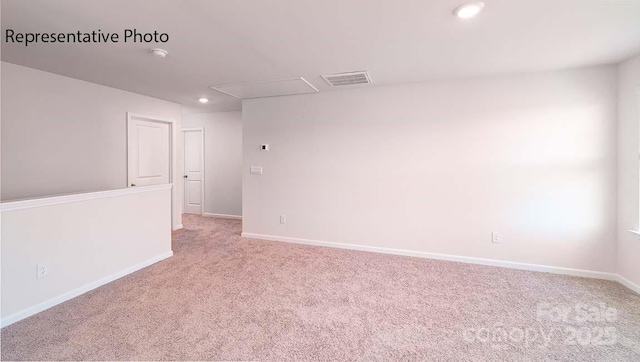 9223 Poquoson Dr, Gastonia, NC 28056 - spare room featuring attic access, light carpet, a smoke detector, and recessed lighting