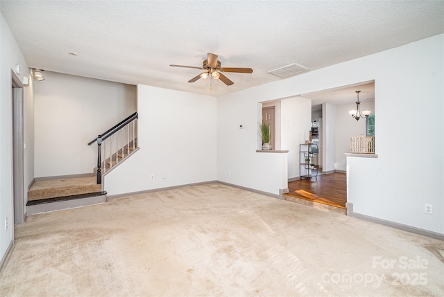 3630 Melrose Cottage Dr, Matthews, NC 28105 - unfurnished living room featuring carpet floors, a ceiling fan, stairs, and a chandelier