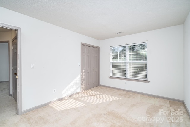 3630 Melrose Cottage Dr, Matthews, NC 28105 - unfurnished bedroom with light colored carpet and a closet