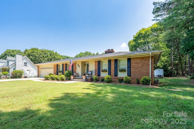 304 Sowers Ferry Rd, Salisbury, NC 28144 - ranch-style house featuring an attached garage, a front yard, and a chimney