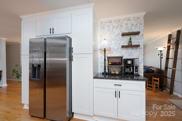 304 Sowers Ferry Rd, Salisbury, NC 28144 - kitchen featuring stainless steel fridge with ice dispenser, crown molding, light wood-type flooring, dark stone countertops, and white cabinets