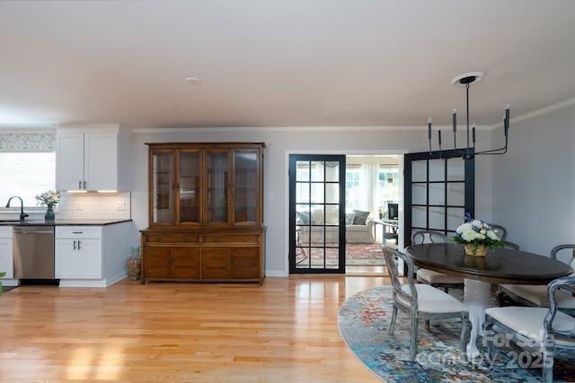 304 Sowers Ferry Rd, Salisbury, NC 28144 - dining room with light wood-type flooring and crown molding