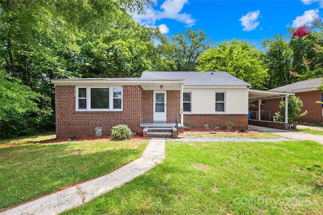 716 Wilson Rd, Salisbury, NC 28144 - view of front of house featuring brick siding, a carport, a front yard, crawl space, and driveway