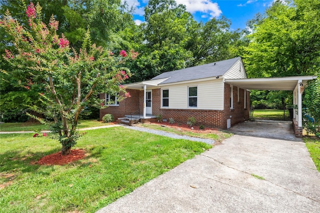716 Wilson Rd, Salisbury, NC 28144 - bungalow-style house featuring driveway, brick siding, an attached carport, and a front yard
