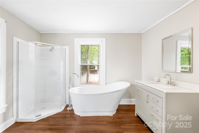 716 Wilson Rd, Salisbury, NC 28144 - full bath featuring vanity, a freestanding tub, wood finished floors, and a shower stall