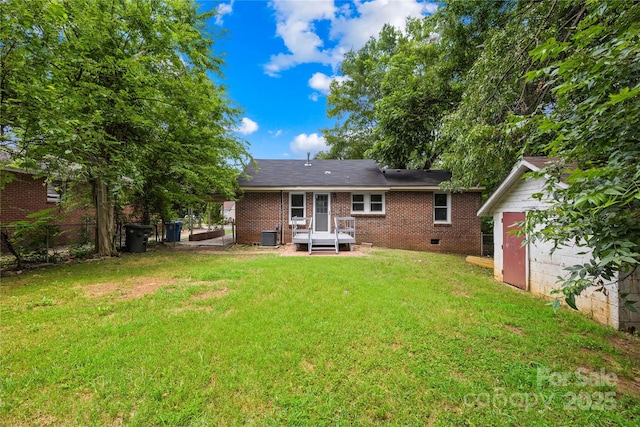 716 Wilson Rd, Salisbury, NC 28144 - rear view of house with a storage shed, crawl space, and brick siding