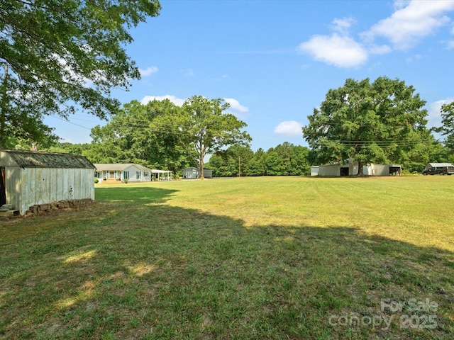 2212 Jb Denton Rd, Lancaster, SC 29720 - view of green lawn featuring a storage shed
