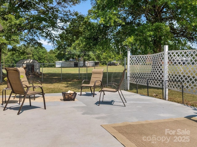 2212 Jb Denton Rd, Lancaster, SC 29720 - view of patio / terrace featuring a fire pit, grilling area, and view of scattered trees