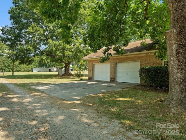 2212 Jb Denton Rd, Lancaster, SC 29720 - view of green lawn with concrete driveway and an attached garage