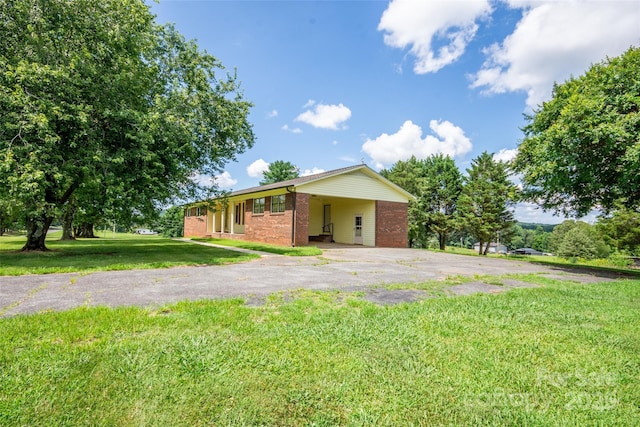 224 Mountain View Rd, Statesville, NC 28625 - view of front of property with asphalt driveway, a front lawn, and brick siding