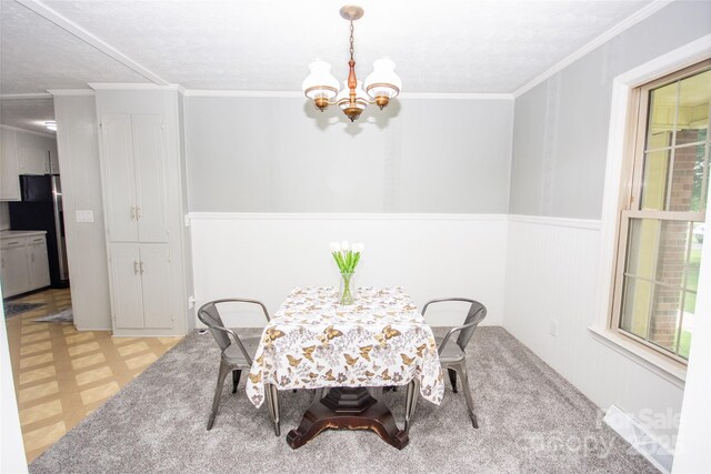 224 Mountain View Rd, Statesville, NC 28625 - dining area featuring a chandelier, light floors, plenty of natural light, and crown molding