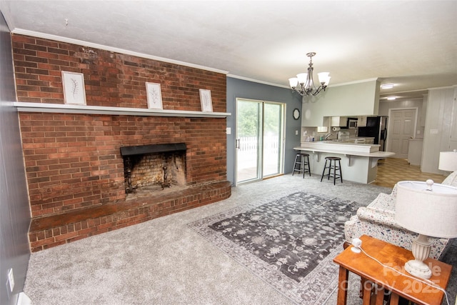 224 Mountain View Rd, Statesville, NC 28625 - carpeted living room with a chandelier, crown molding, and a fireplace