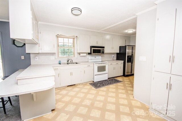 224 Mountain View Rd, Statesville, NC 28625 - kitchen featuring appliances with stainless steel finishes, light floors, a peninsula, light countertops, and decorative backsplash