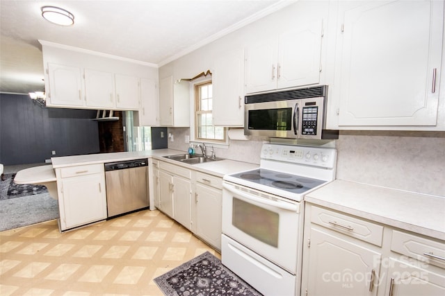 224 Mountain View Rd, Statesville, NC 28625 - kitchen featuring appliances with stainless steel finishes, white cabinets, light flooring, light countertops, and crown molding
