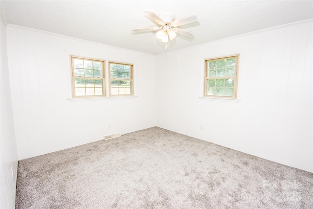 224 Mountain View Rd, Statesville, NC 28625 - unfurnished room featuring carpet floors, healthy amount of natural light, ornamental molding, and a ceiling fan
