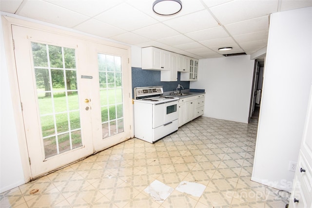 224 Mountain View Rd, Statesville, NC 28625 - kitchen featuring white electric range, a paneled ceiling, light floors, french doors, and white cabinetry