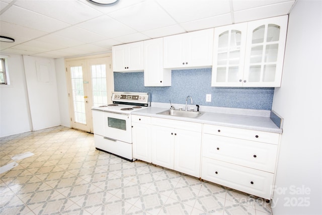 224 Mountain View Rd, Statesville, NC 28625 - kitchen with electric range, light countertops, white cabinetry, decorative backsplash, and a paneled ceiling