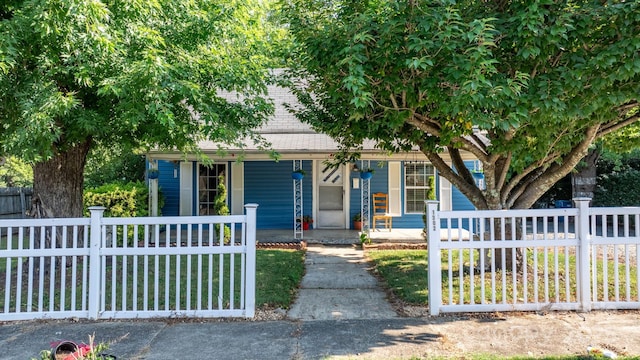 1302 1st Ave NW, Hickory, NC 28601 - view of property hidden behind natural elements featuring a porch and a fenced front yard