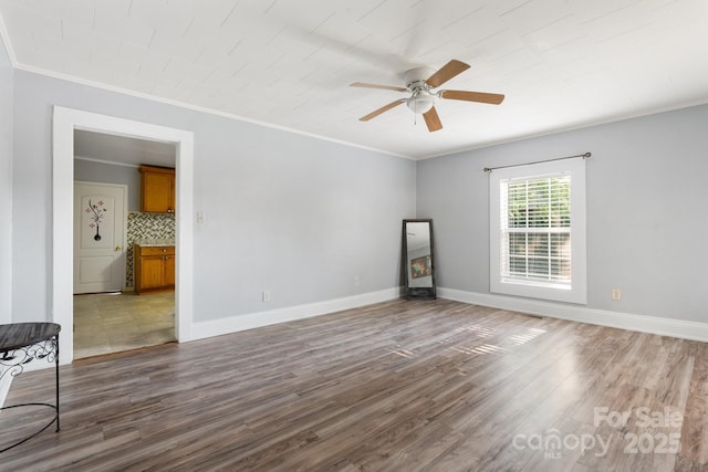 1302 1st Ave NW, Hickory, NC 28601 - empty room with wood finished floors, ceiling fan, and crown molding