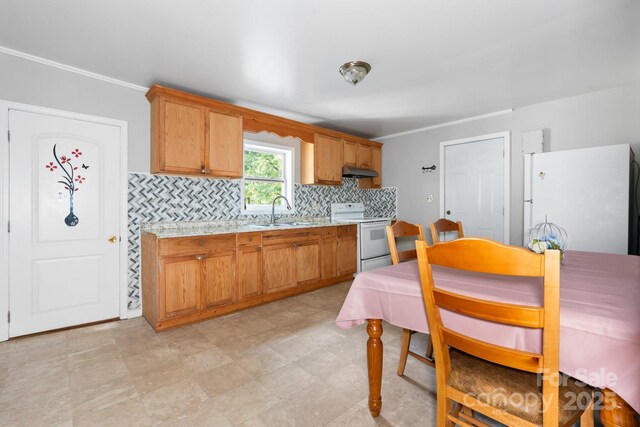 1302 1st Ave NW, Hickory, NC 28601 - kitchen featuring white appliances, under cabinet range hood, light countertops, ornamental molding, and backsplash