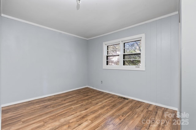 1302 1st Ave NW, Hickory, NC 28601 - empty room featuring wood finished floors and ornamental molding