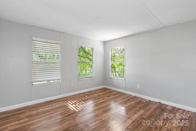 1302 1st Ave NW, Hickory, NC 28601 - unfurnished room with wood finished floors and baseboards