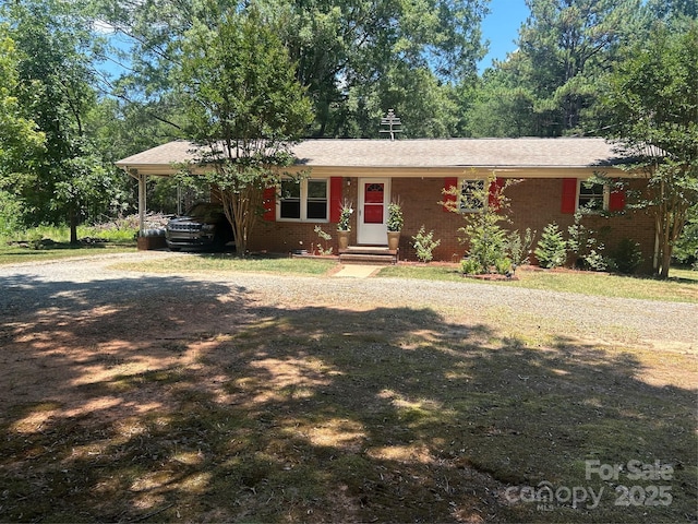 174 Crossrail Rd, Mooresville, NC 28115 - ranch-style house with a carport, dirt driveway, and entry steps