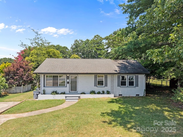 3422 Dublin Rd, Charlotte, NC 28208 - view of front facade with roof with shingles, crawl space, and brick siding
