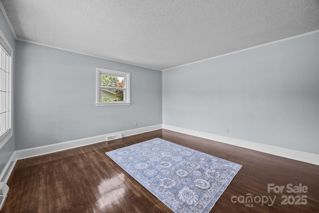 3422 Dublin Rd, Charlotte, NC 28208 - empty room with a textured ceiling, wood finished floors, and crown molding