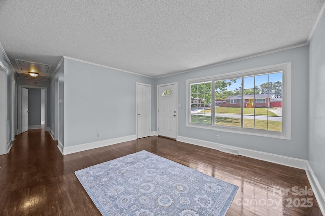 3422 Dublin Rd, Charlotte, NC 28208 - entryway featuring wood finished floors, a textured ceiling, and ornamental molding