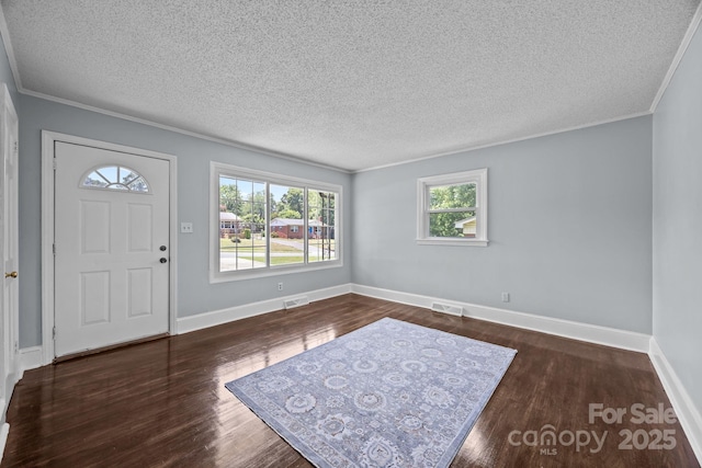 3422 Dublin Rd, Charlotte, NC 28208 - foyer featuring wood finished floors, a textured ceiling, and crown molding