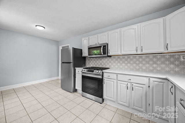 3422 Dublin Rd, Charlotte, NC 28208 - kitchen featuring stainless steel appliances, decorative backsplash, light countertops, and white cabinetry