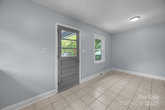 3422 Dublin Rd, Charlotte, NC 28208 - doorway featuring light tile patterned floors and baseboards