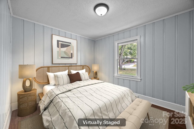 3422 Dublin Rd, Charlotte, NC 28208 - bedroom featuring ornamental molding, wood finished floors, and a textured ceiling
