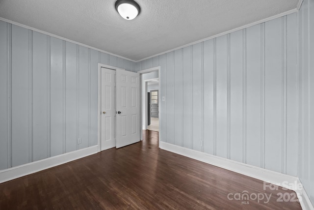 3422 Dublin Rd, Charlotte, NC 28208 - unfurnished room with a textured ceiling, wood finished floors, and crown molding