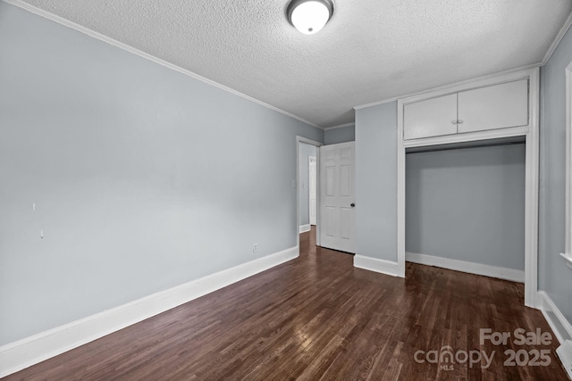 3422 Dublin Rd, Charlotte, NC 28208 - unfurnished bedroom with a textured ceiling, dark wood-type flooring, a closet, and ornamental molding