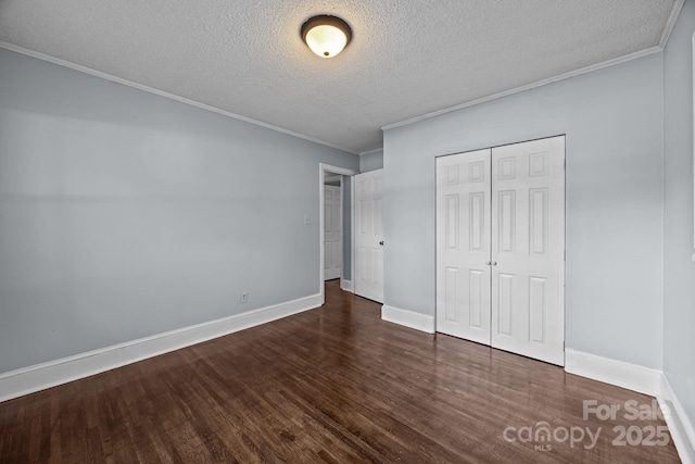 3422 Dublin Rd, Charlotte, NC 28208 - unfurnished bedroom with a textured ceiling, wood finished floors, crown molding, and a closet