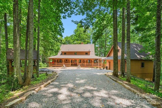 492 Henry Mountain Rd, Brevard, NC 28712 - view of front of home featuring a porch, a garage, a chimney, and driveway