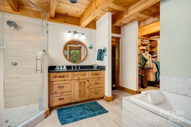 492 Henry Mountain Rd, Brevard, NC 28712 - full bath featuring a wooden ceiling with exposed beams, vanity, a stall shower, a bath, and a walk in closet